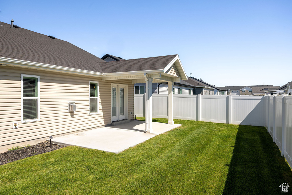 Fenced backyard featuring a patio area