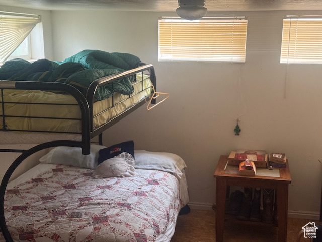 Bedroom featuring carpet and baseboards