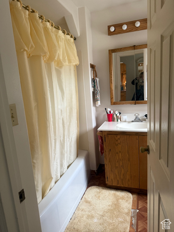 Bathroom with vanity and shower / bath combo