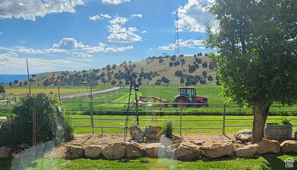 View of mountain background featuring rural landscape and agricultural land