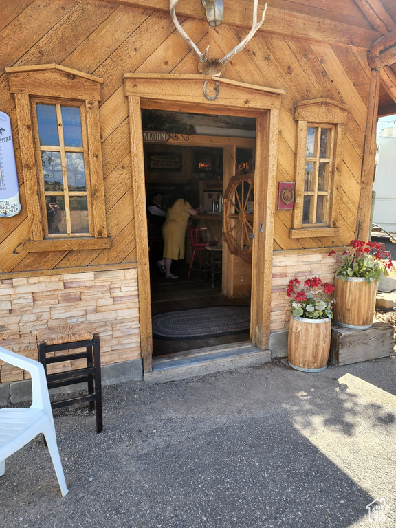 Doorway to property with stone siding