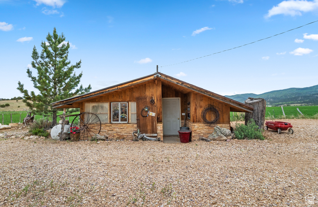 View of front of house featuring a mountain view and stone siding