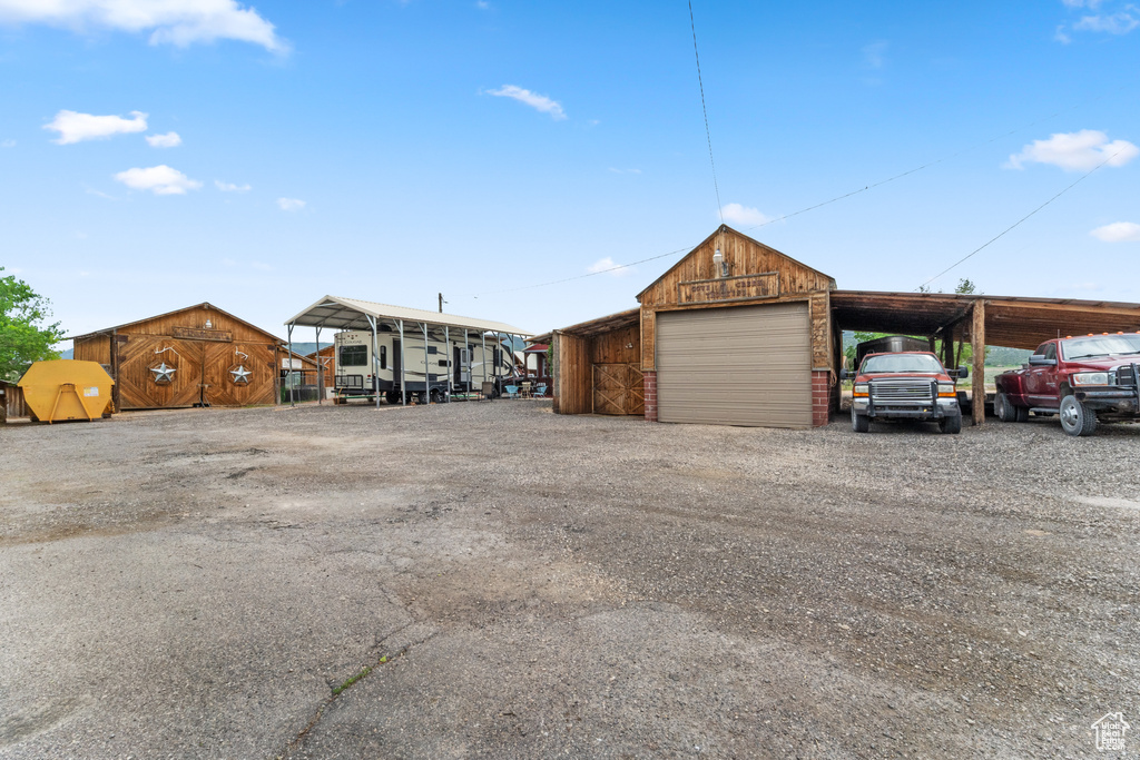 Garage with a detached garage and driveway