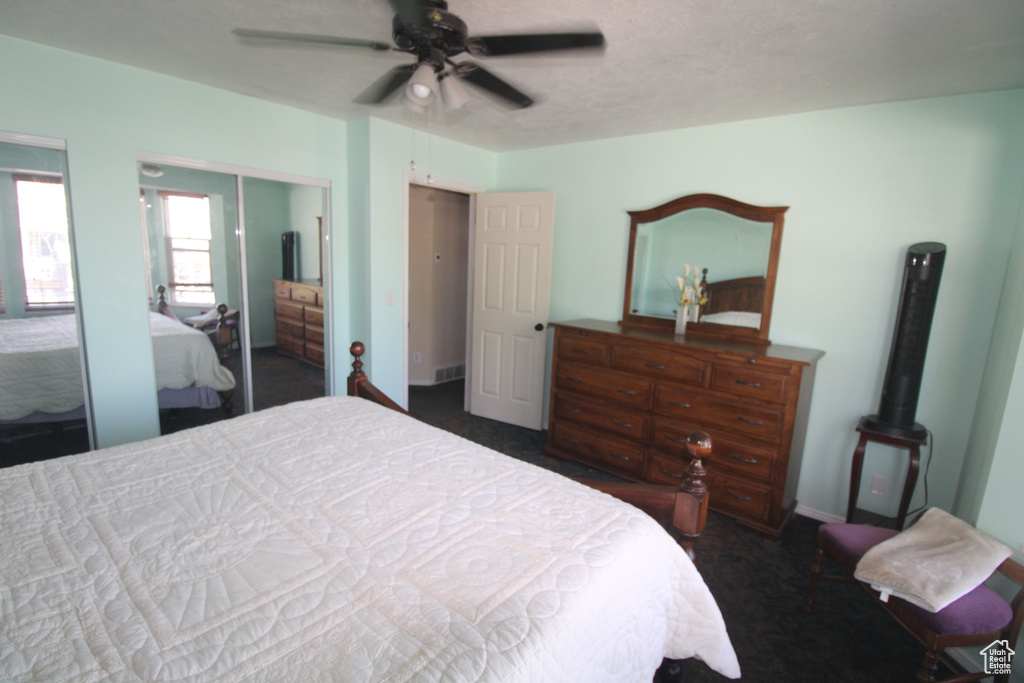 Bedroom with carpet floors and a ceiling fan