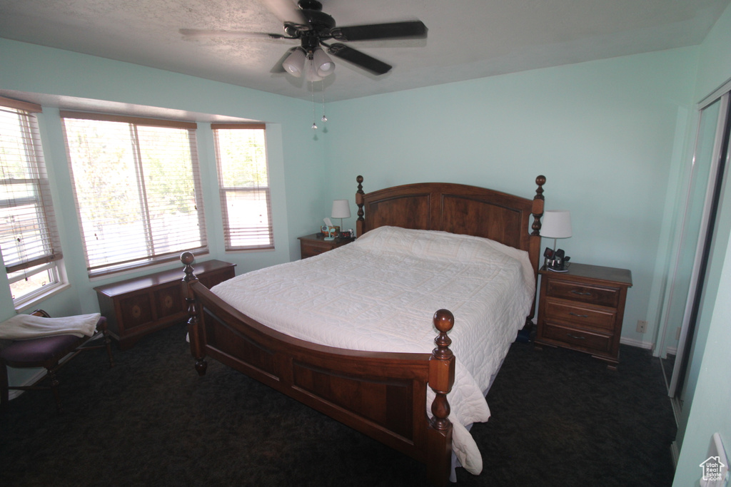 Bedroom with carpet floors and a ceiling fan
