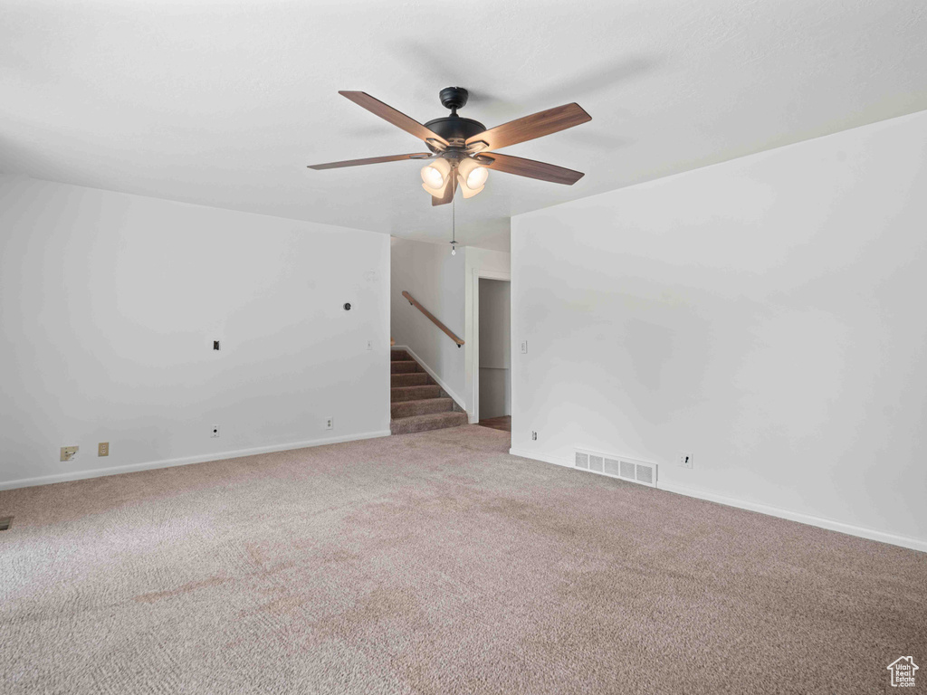 Unfurnished room with carpet floors and ceiling fan