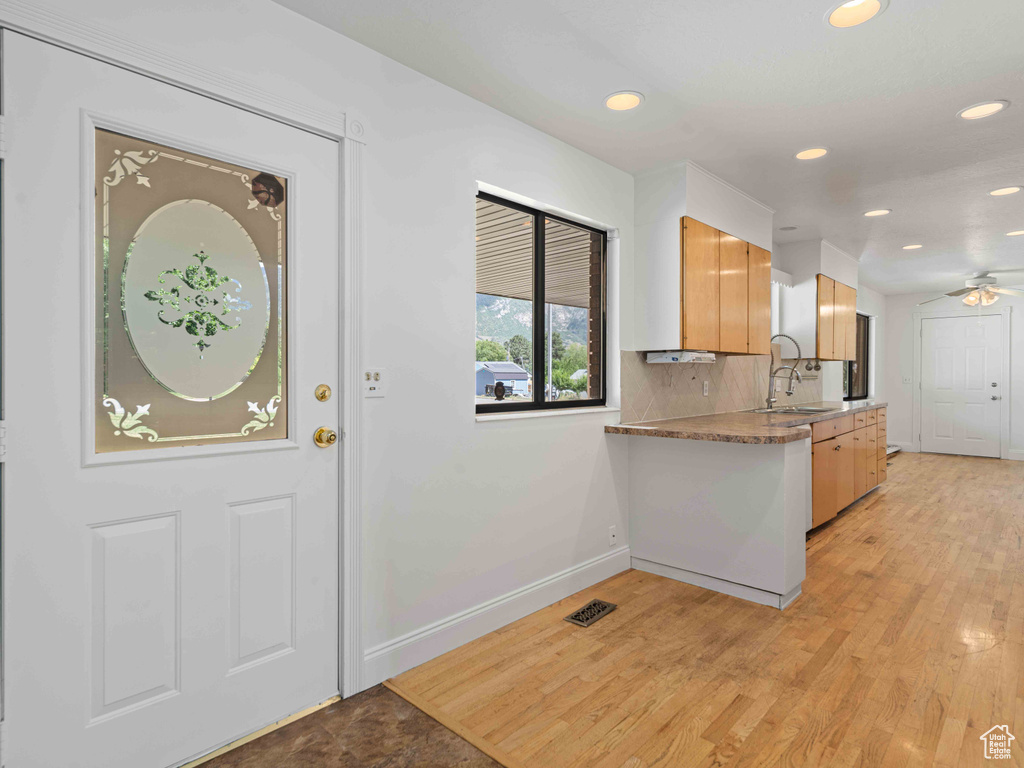 Kitchen featuring recessed lighting, ceiling fan, and light wood finished floors