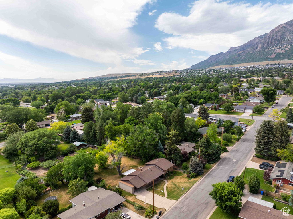 Aerial perspective of suburban area with a mountain backdrop