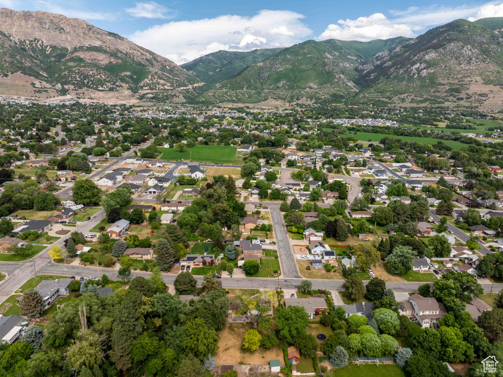Aerial view of property's location with a mountainous background