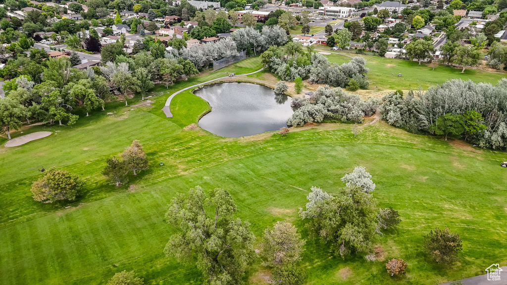 Aerial perspective of suburban area with a large body of water and a local golf course
