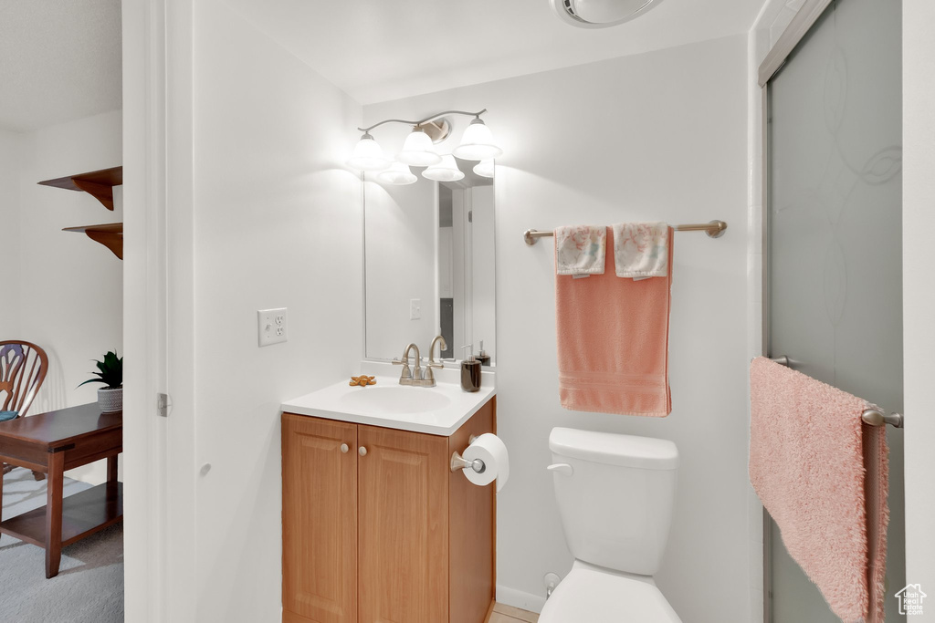 Bathroom featuring vanity and toilet