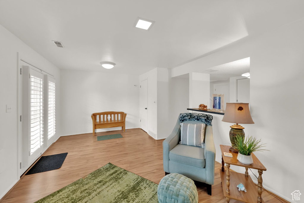 Sitting room featuring light wood finished floors