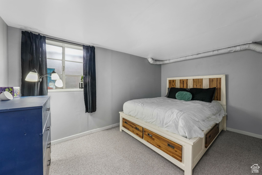 Carpeted bedroom with baseboards