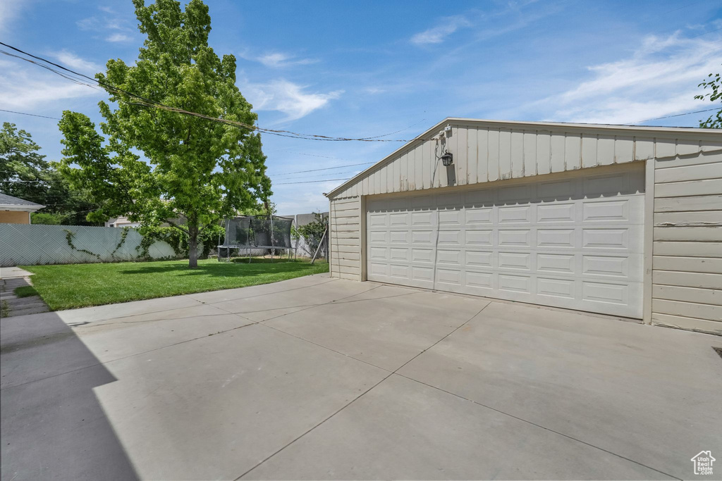 Detached garage with a trampoline