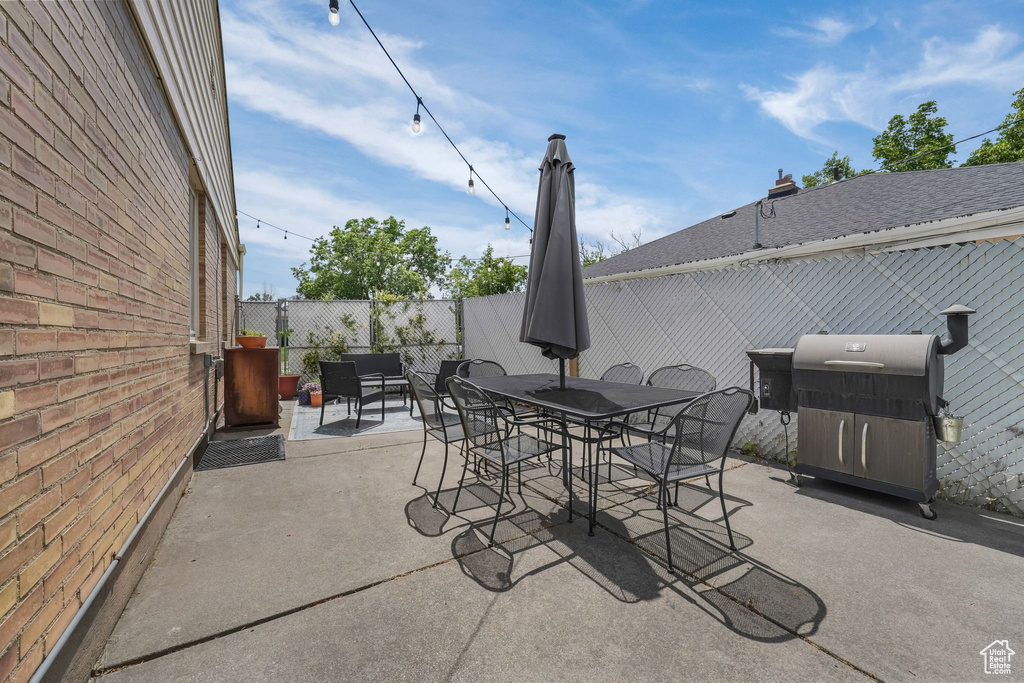 View of patio / terrace featuring outdoor dining space and a grill