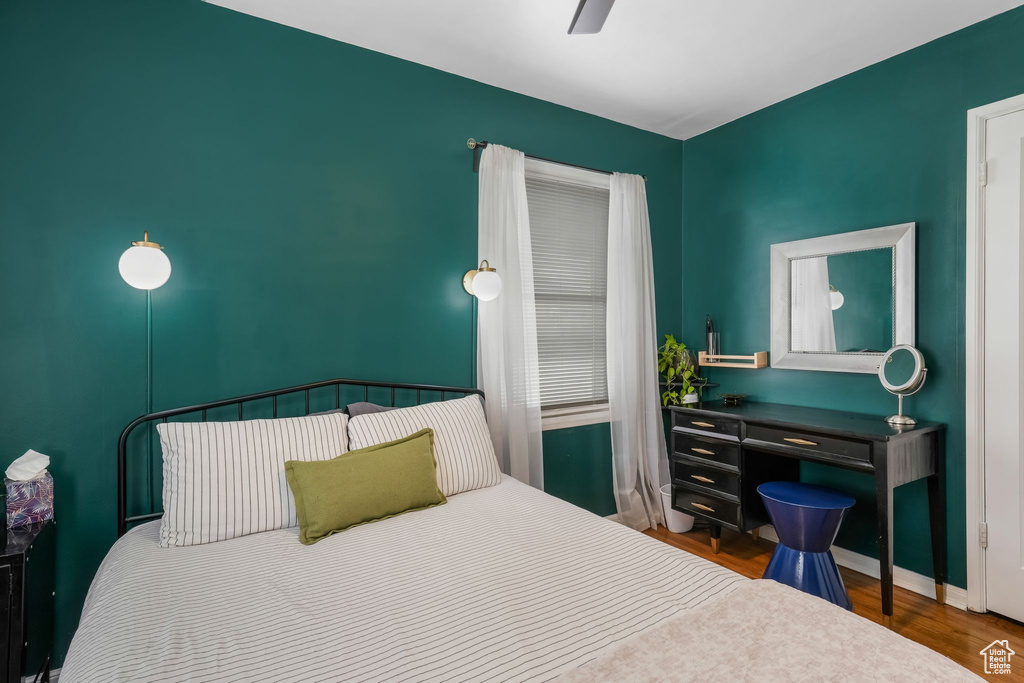 Bedroom with wood finished floors and ceiling fan