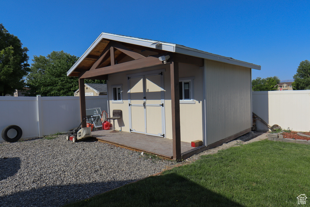 View of shed with a fenced backyard