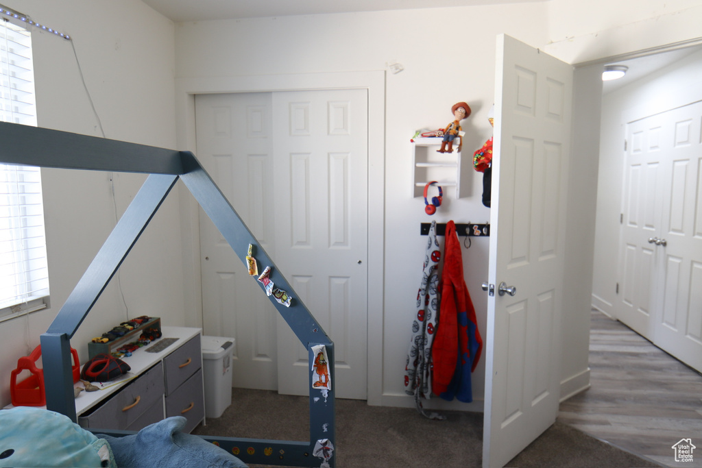 Bedroom with multiple windows and a closet