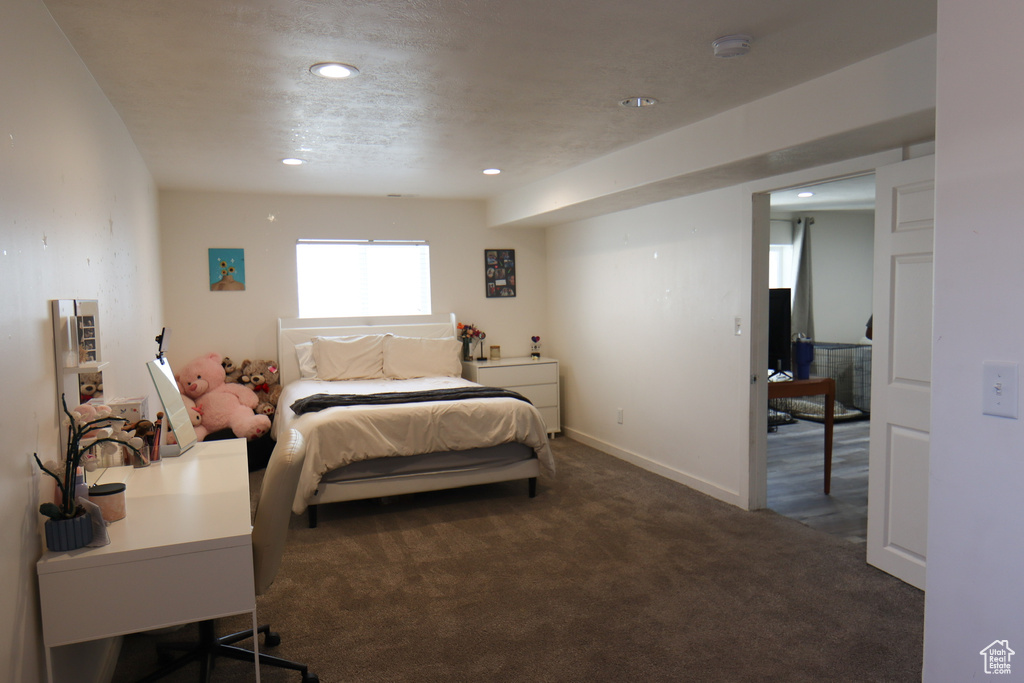 Carpeted bedroom featuring recessed lighting and baseboards