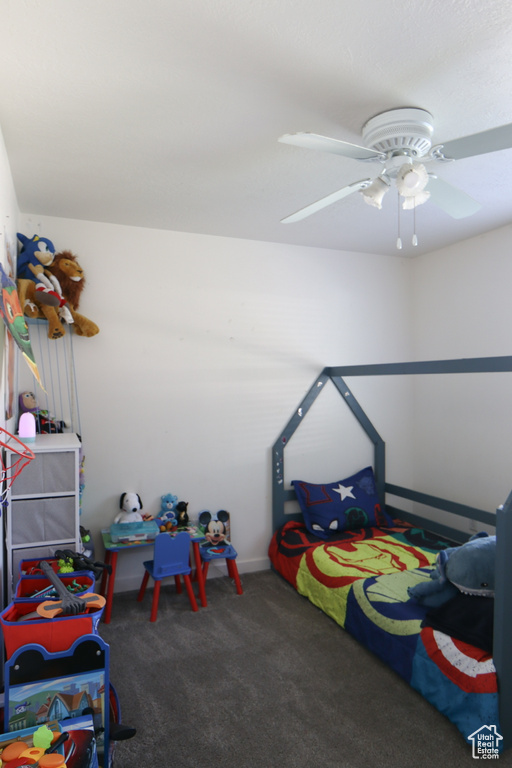 Playroom with carpet and ceiling fan