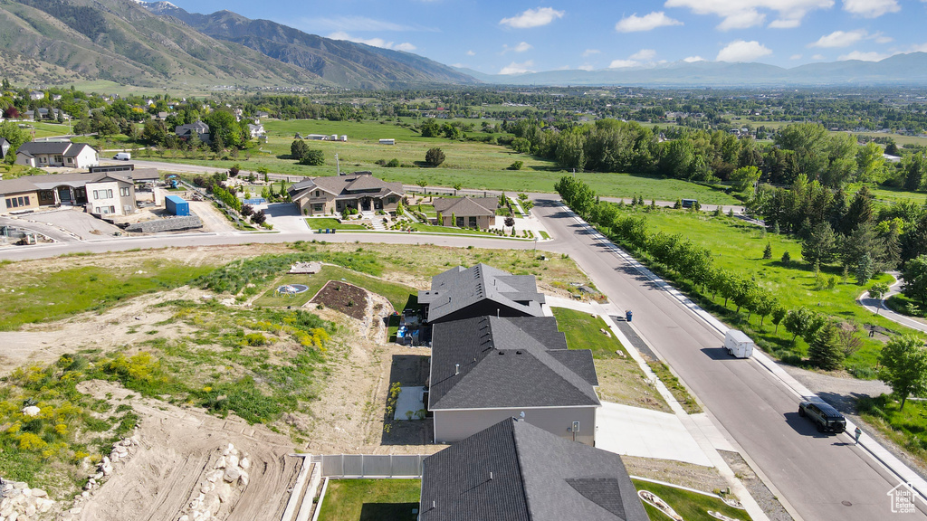 Aerial view of residential area featuring mountains