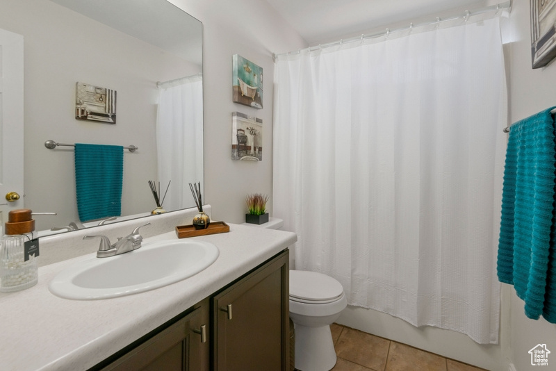 Bathroom featuring vanity and tile patterned floors