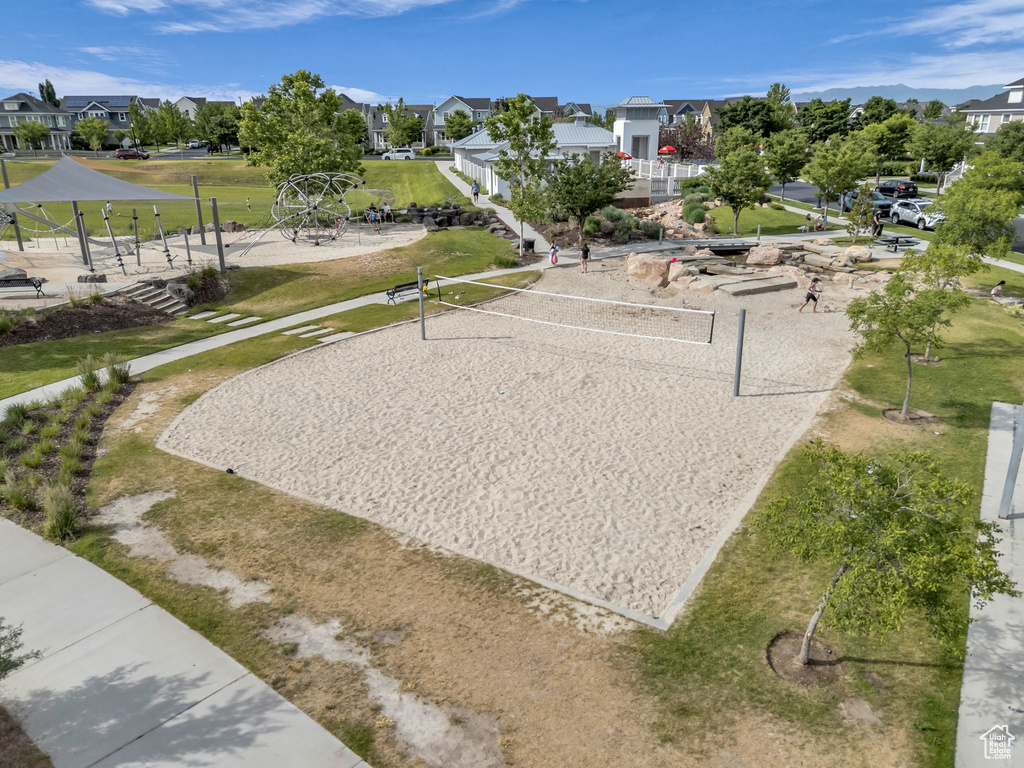 Surrounding community featuring volleyball court and a residential view