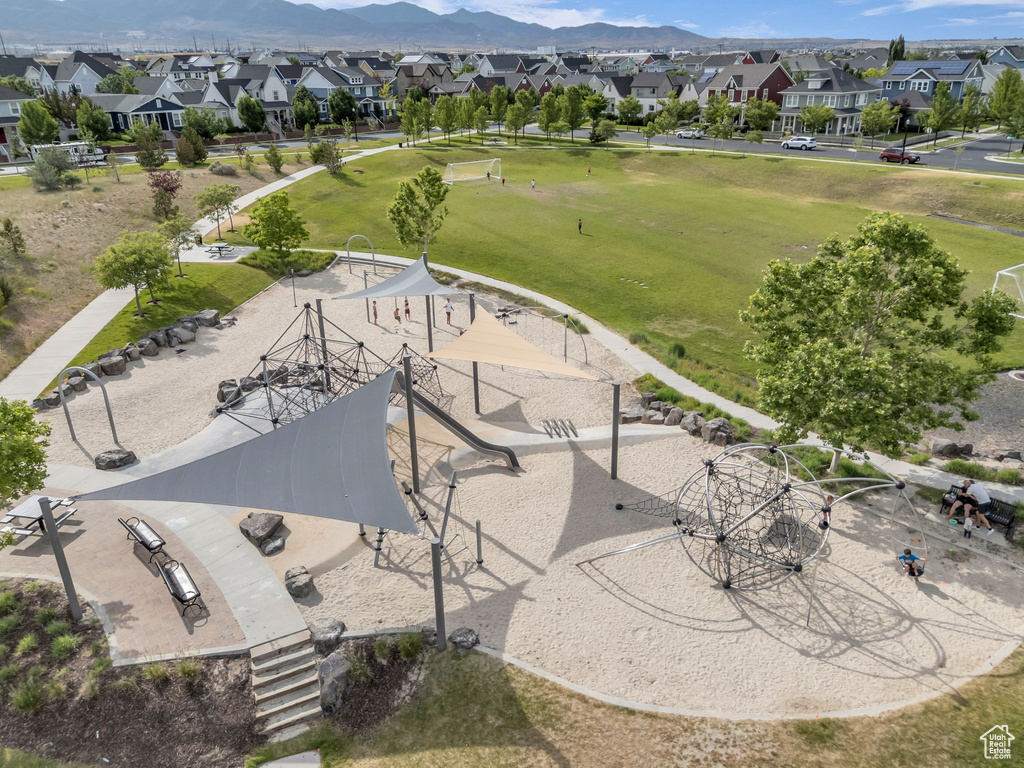 Aerial perspective of suburban area with a mountainous background