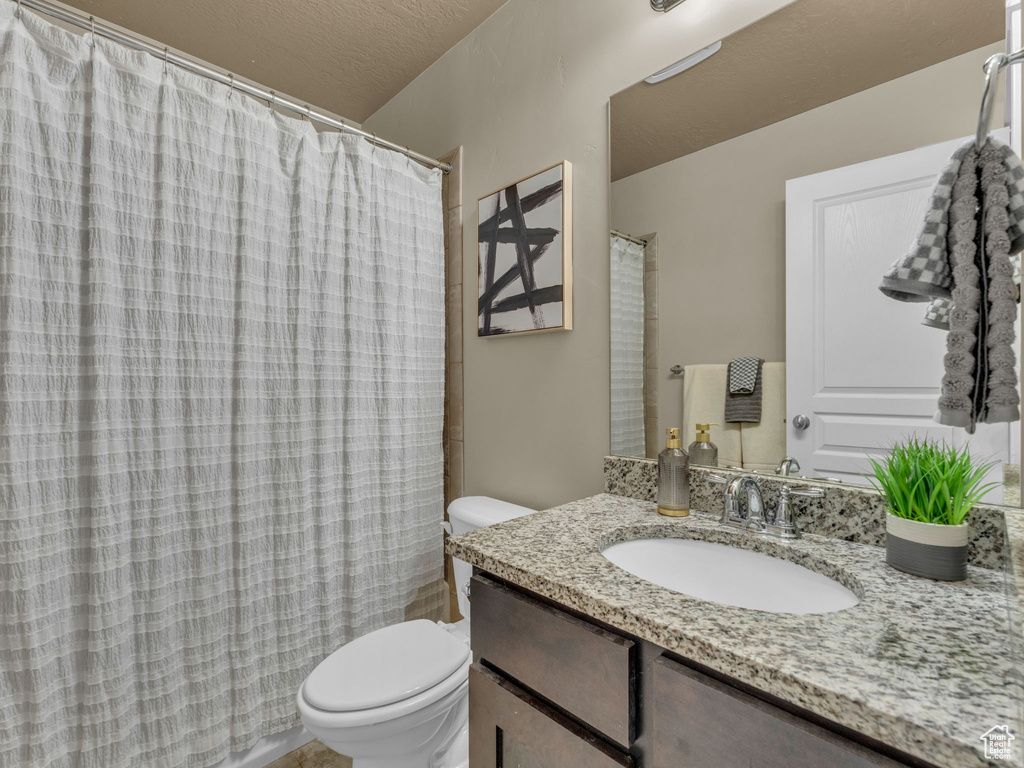 Bathroom with vanity and a shower with curtain