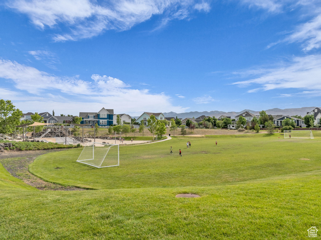 Surrounding community featuring an area for sports and a residential view