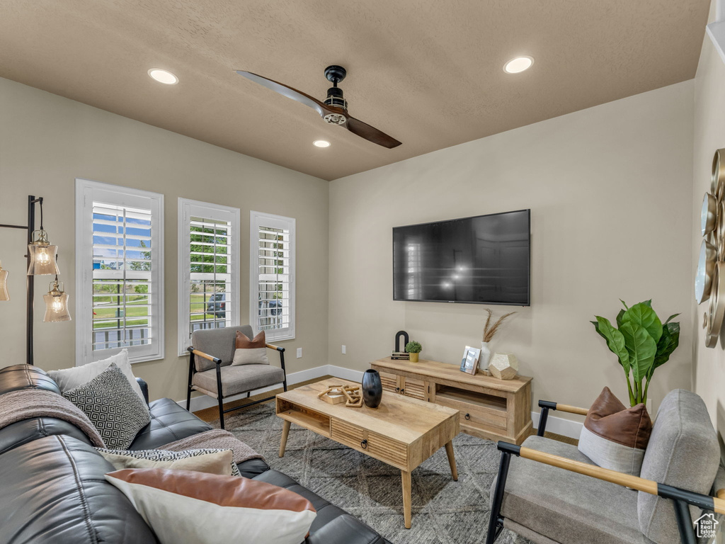 Living area featuring ceiling fan and recessed lighting