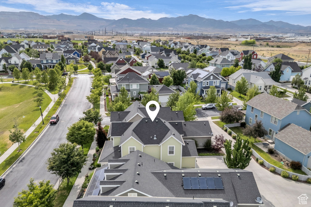 Aerial perspective of suburban area featuring a mountainous background