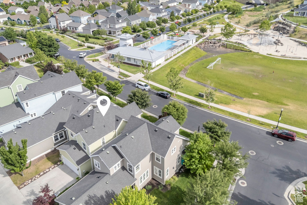 Aerial view of residential area featuring a pool