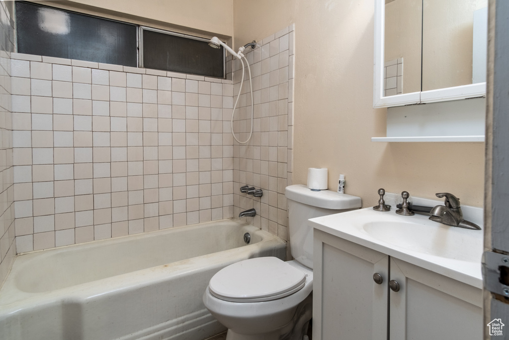 Bathroom featuring shower / washtub combination and vanity