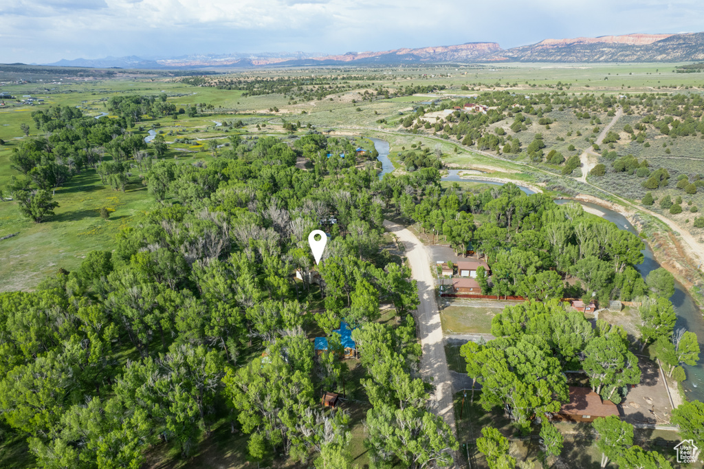 Aerial overview of property\'s location with a mountainous background