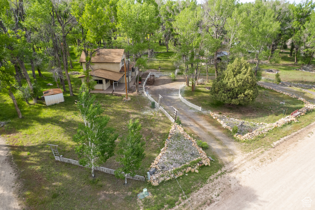 View of property\'s community featuring view of scattered trees and a shed