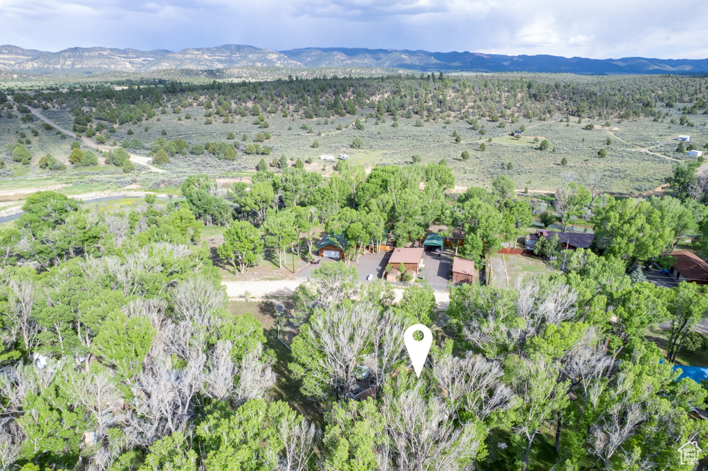 Aerial overview of property\'s location with a mountainous background