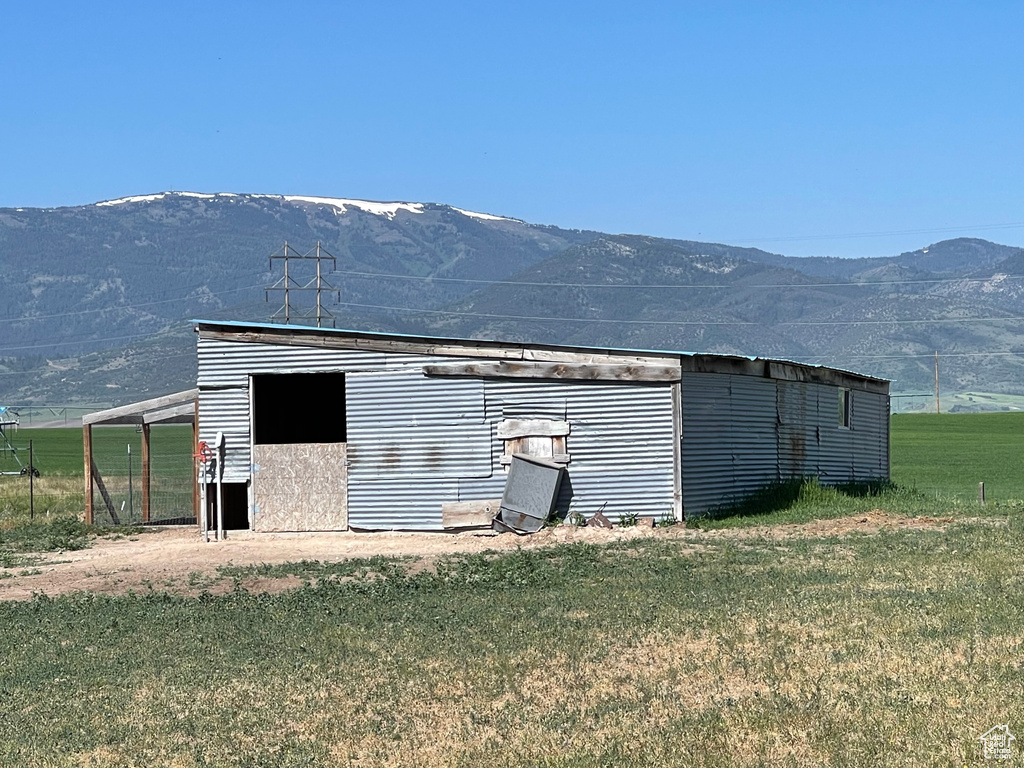 View of outbuilding with a mountain view
