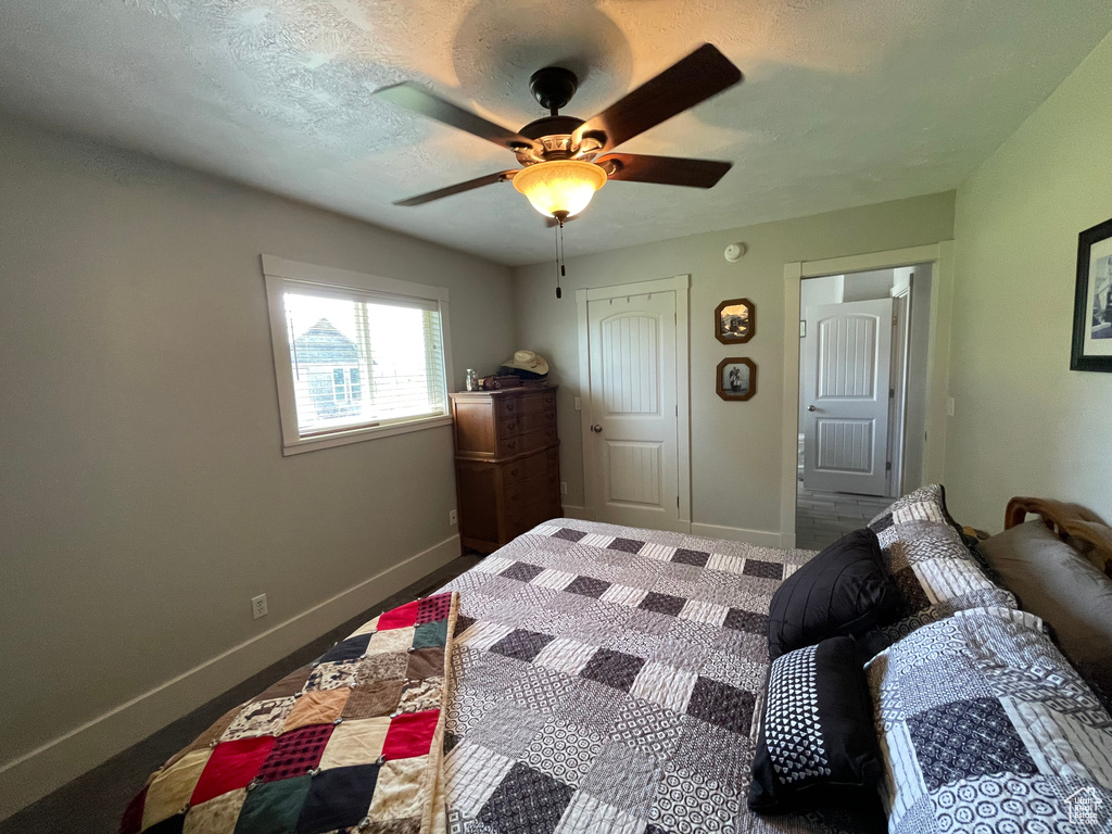 Bedroom with baseboards and a ceiling fan