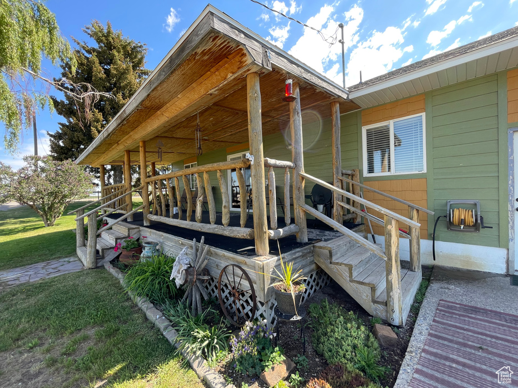 View of side of home with a yard