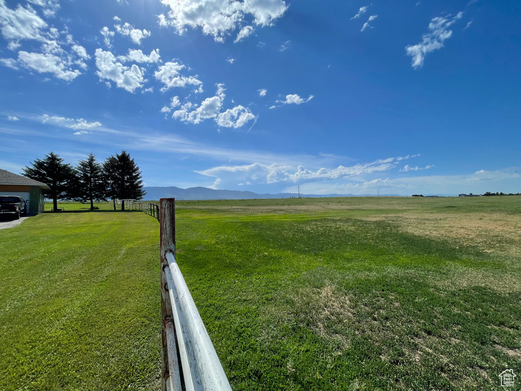 View of yard with a view of rural / pastoral area and a mountain view