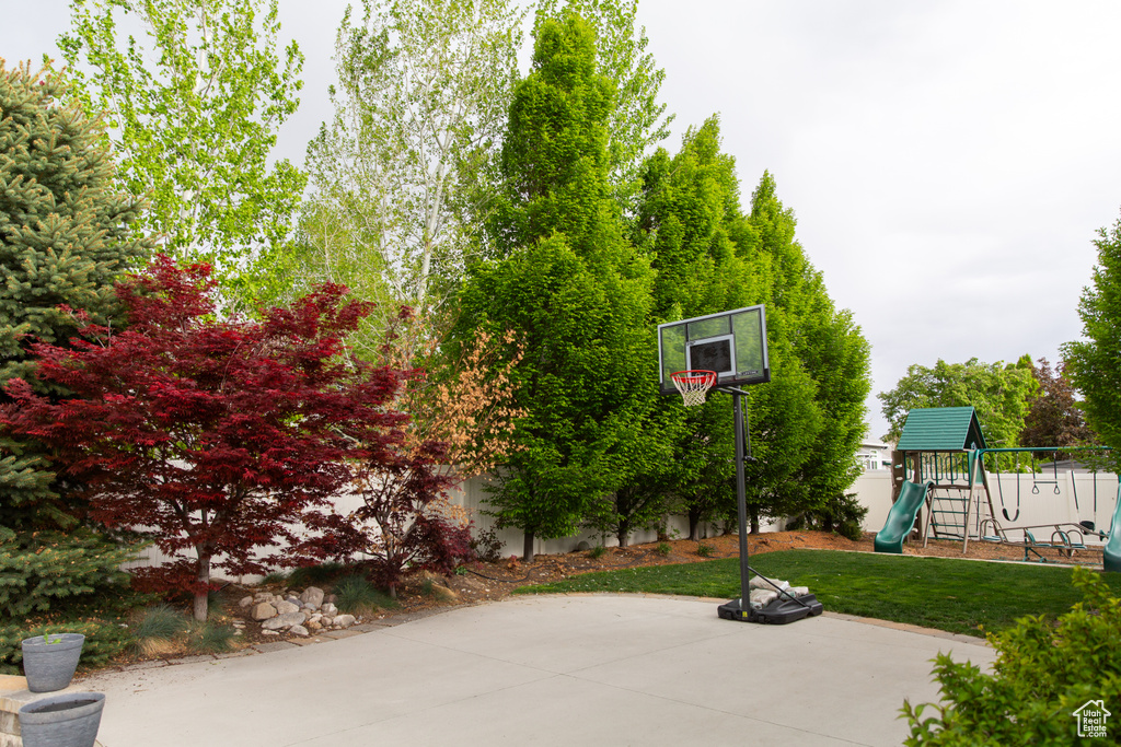 View of patio featuring a playground