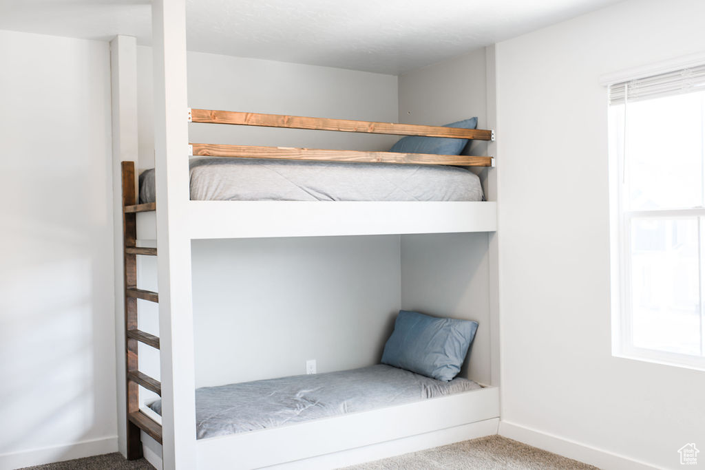 Unfurnished bedroom with carpet flooring