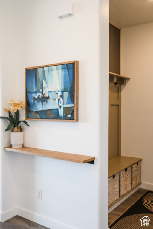Mudroom featuring baseboards and wood finished floors