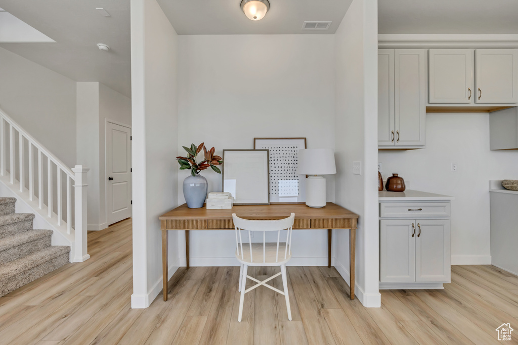 Office space featuring light wood-style flooring