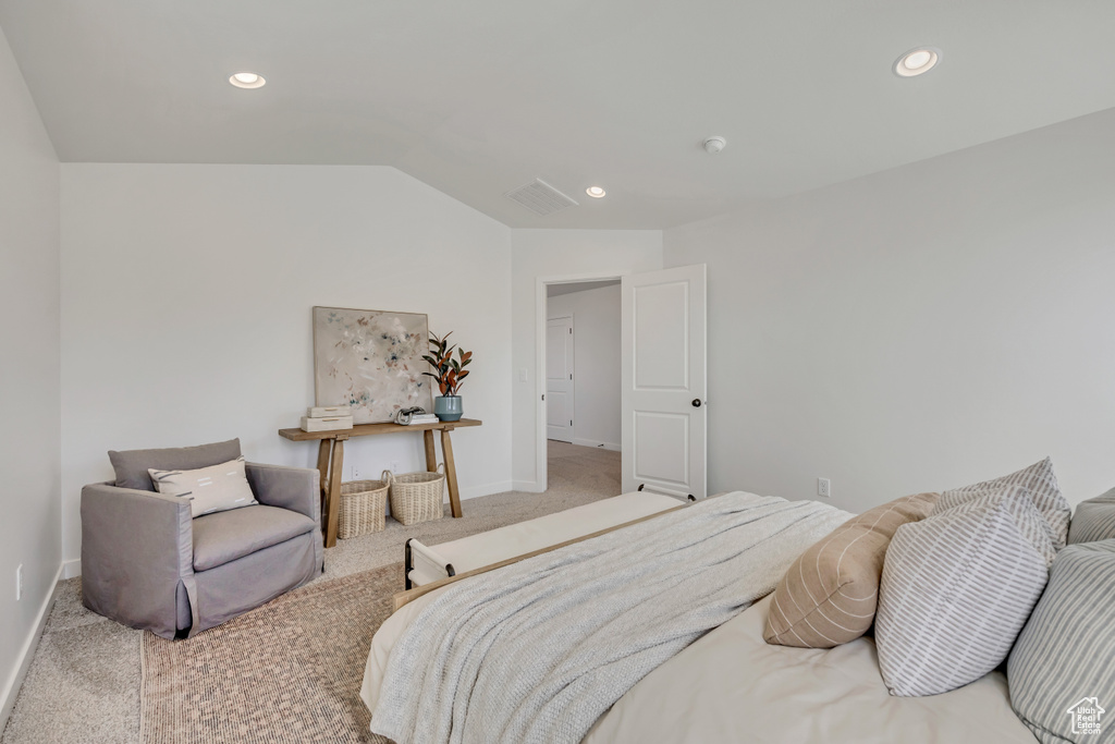 Bedroom with carpet, lofted ceiling, and recessed lighting