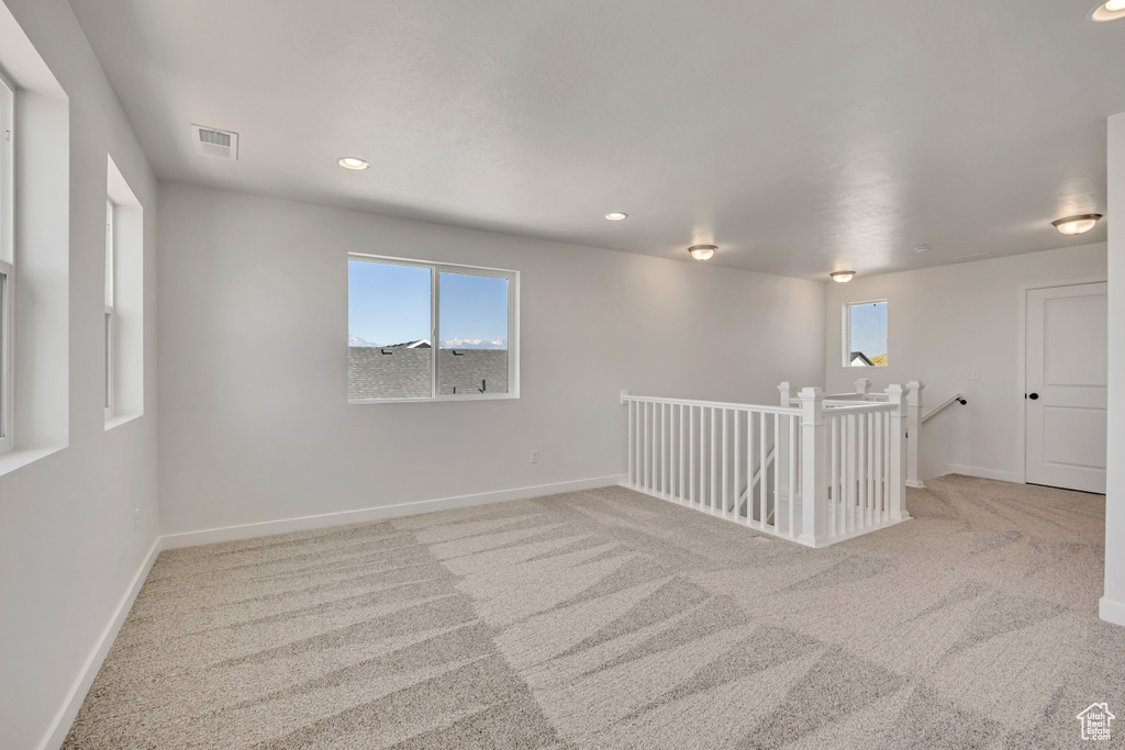 Spare room with carpet flooring and recessed lighting