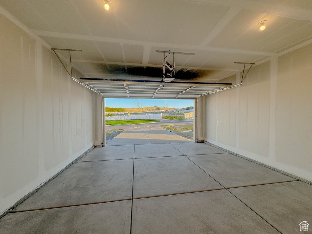 Garage featuring a garage door opener