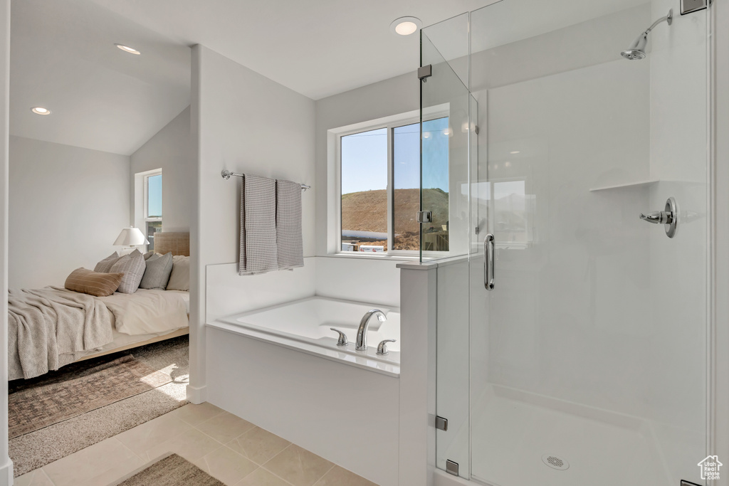 Ensuite bathroom featuring a stall shower, a garden tub, recessed lighting, vaulted ceiling, and tile patterned floors