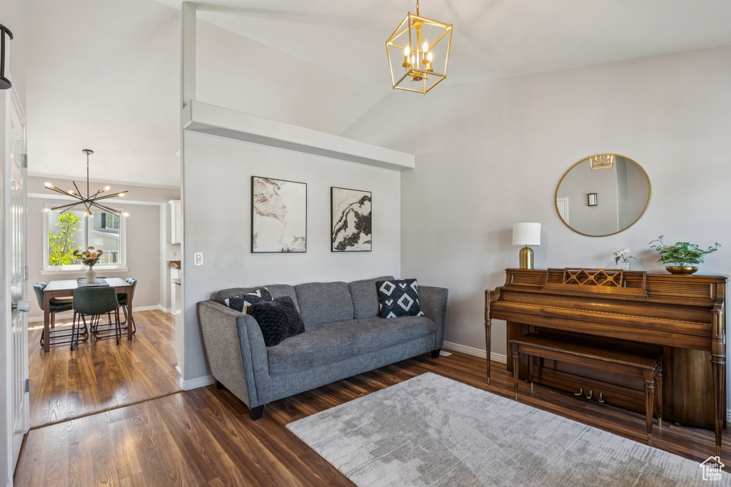 Living area with a chandelier and wood finished floors